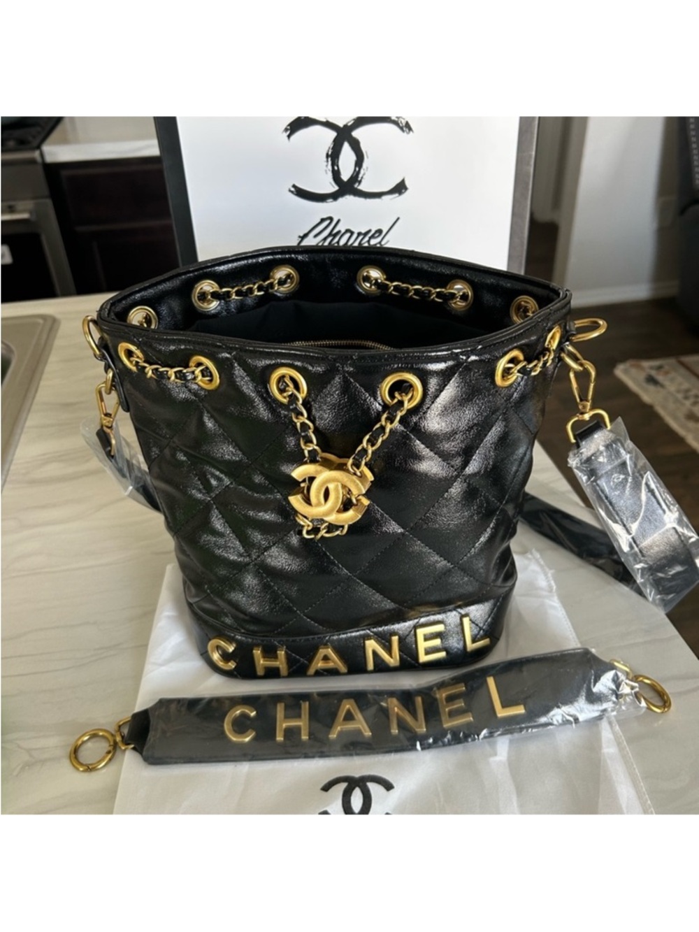 CHANEL VIP Black Quilted Leather Bucket Bag with Gold Hardware and Logo Strap